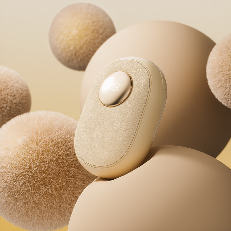 Bombom rechargeable digital hand warmer in beige with LED temperature display on soft textured background